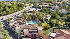An aerial view of a coastal residential area with houses, a swimming pool, and a road. - Studio apartment 2 beds, about 30 square meters, living room with kitchenette and single beds that can be joined together, bathroom with shower. Possibility of cot (with supplement). <br>Comfortably furnished apartments, they can be on the ground floor w (Palau)