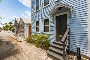 Stunning two-story home with a charming front entrance and inviting porch.