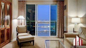 A spacious living room with a large sliding glass door leading to a balcony with a city view. - MGM Signature-28-602 1Br 2Ba Balcony Jacuzzi Suite (Las Vegas)