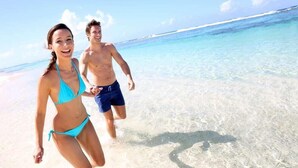A beach scene with clear turquoise water and white sand. - DISCOUNTED!~FREE Activities~6 SEAT GOLF CART~Pool~Hot tub~pets considered (Miramar Beach)