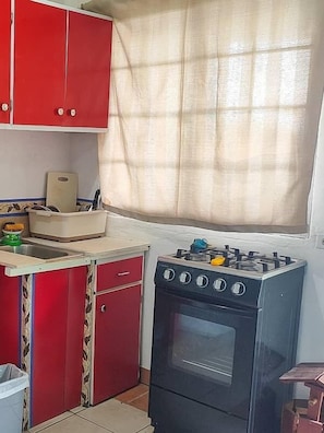 Full-size fridge, espresso maker, cookware/dishes/utensils