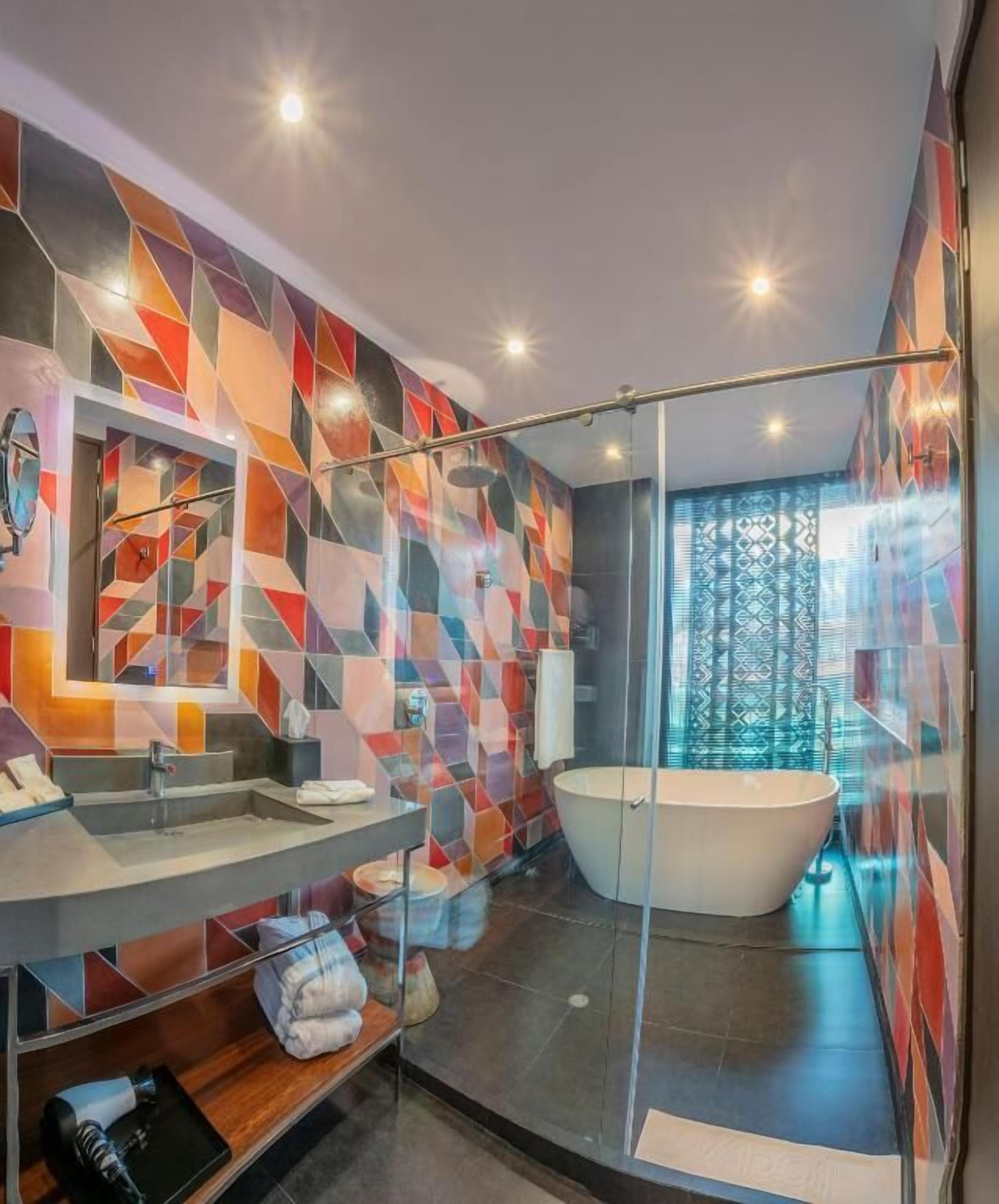 deluxe suite, 1 king bed | bathroom | shower, rainfall showerhead, free toiletries, hair dryer