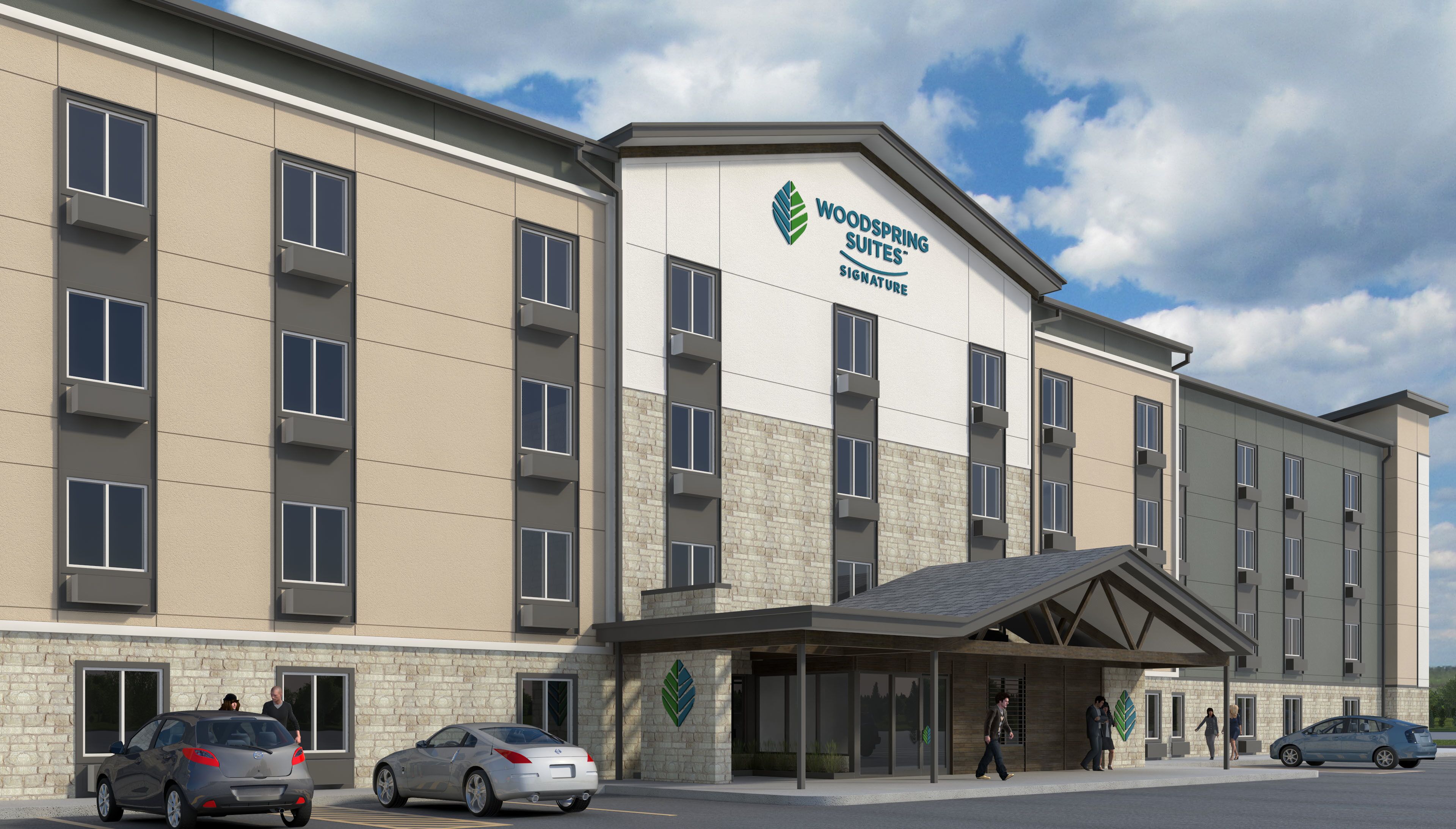 A modern hotel building with a sign reading "Woodspring Suites Signature".