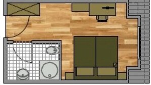 A room with a wooden floor, a kitchen area with a sink and stove, a small dining table, and a large window. - Comfortable non-smoking apartment Die Remise Marengo RE-11 on Usedom - The (Stolpe auf Usedom)