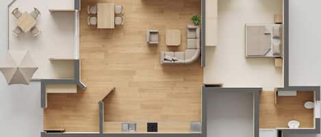 A floor plan of a hotel room with a kitchenette, a dining area, a living room with a sofa and a coffee table, and a bathroom.