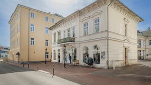 A two-story building with a ground-floor shop and upper residential units.