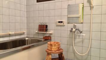 Combined shower/tub, hair dryer, towels, soap