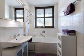 Bathtub, hair dryer, towels