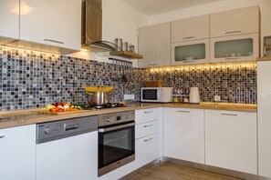Fridge, microwave, oven, stovetop - Villa Cujez with Pool & Sauna, Rečica ob Savinji, Slovenia (Rečica ob Savinji)