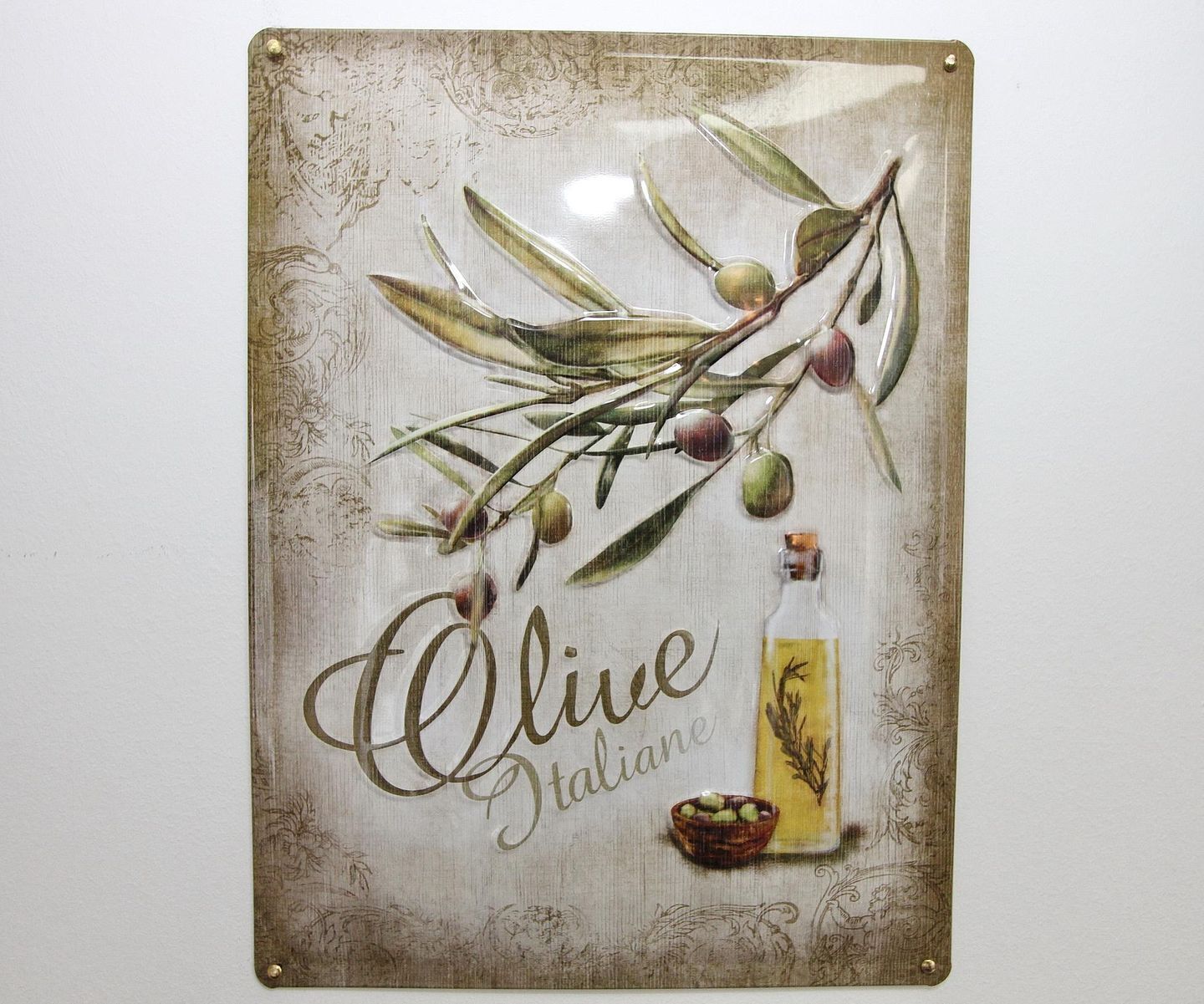 A decorative sign with the text "Olive Italiane" and an illustration of olive branches and olives.