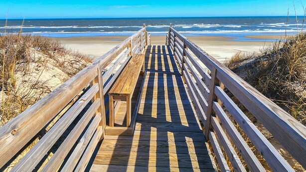A wooden boardwalk leading to a beach with sand dunes and ocean views. - Luap's Place - Oceanside 5 BR home w/ Private Pool and Hot Tub (Corolla)