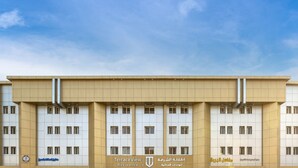 A multi-story building with a beige facade, multiple windows, and signage indicating it is a residence. - Terrace View 1 serviced apartments - اطلالة الشرفة 1 للشقق المخدومة (Al Khobar)