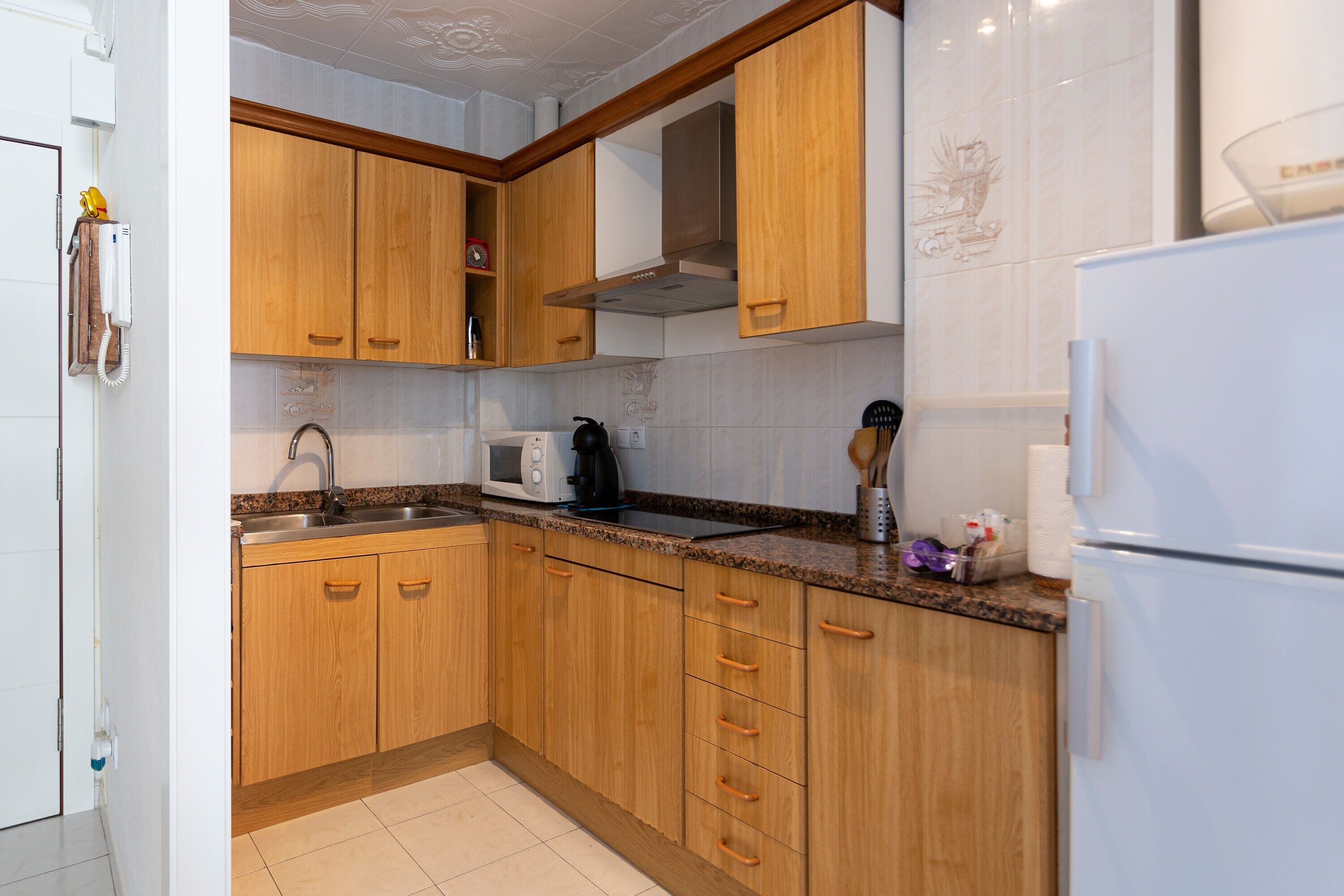 Fridge, microwave, stovetop, coffee/tea maker