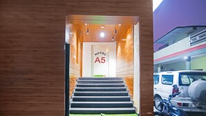 A hotel entrance with a staircase leading to the interior. - Treebo A5 (Indore)