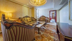 A luxurious room with ornate furniture, a chandelier, and patterned flooring. - Yifeng Hotel (Yifeng)
