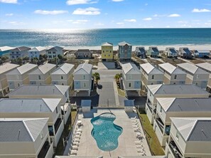 Enjoy a refreshing swim in the central pool with ocean views.