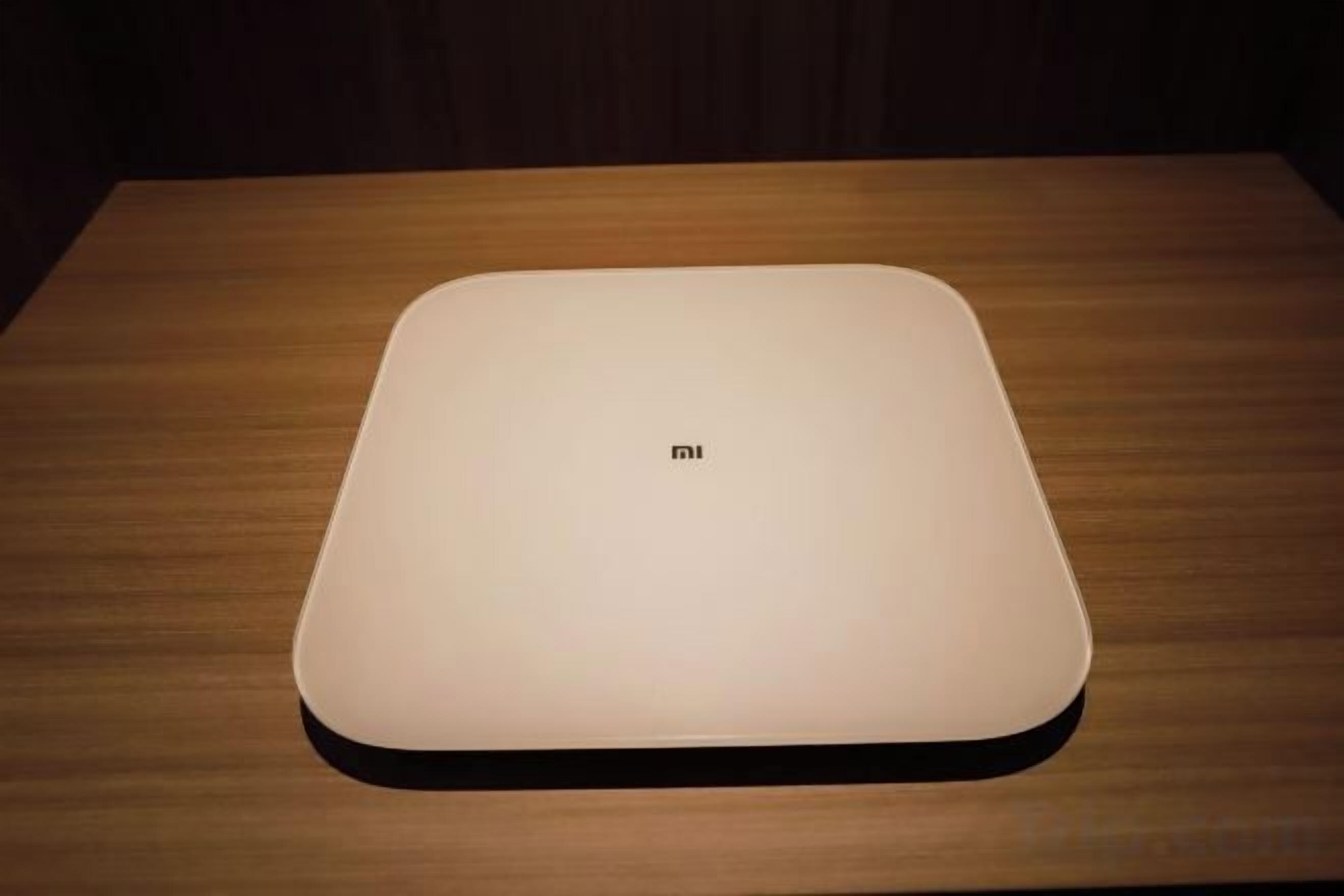 A flat-screen TV on a wooden table.