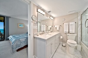 Combined shower/bathtub, hair dryer, towels - Loggerhead Cay 114 is a beachfront vacation rental condo on Sanibel Island! (Sanibel)