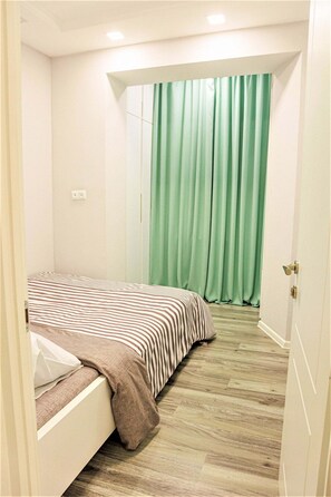 1 غرفة نوم ومكواة/لوح كي وواي فاي مجانًا وملاءات أسرّة