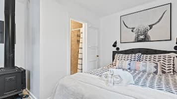 1 bedroom, desk, iron/ironing board, travel crib