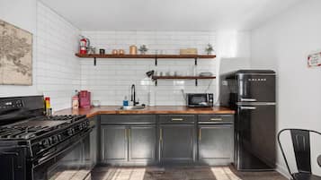 Fridge, coffee/tea maker, toaster, cookware/dishes/utensils