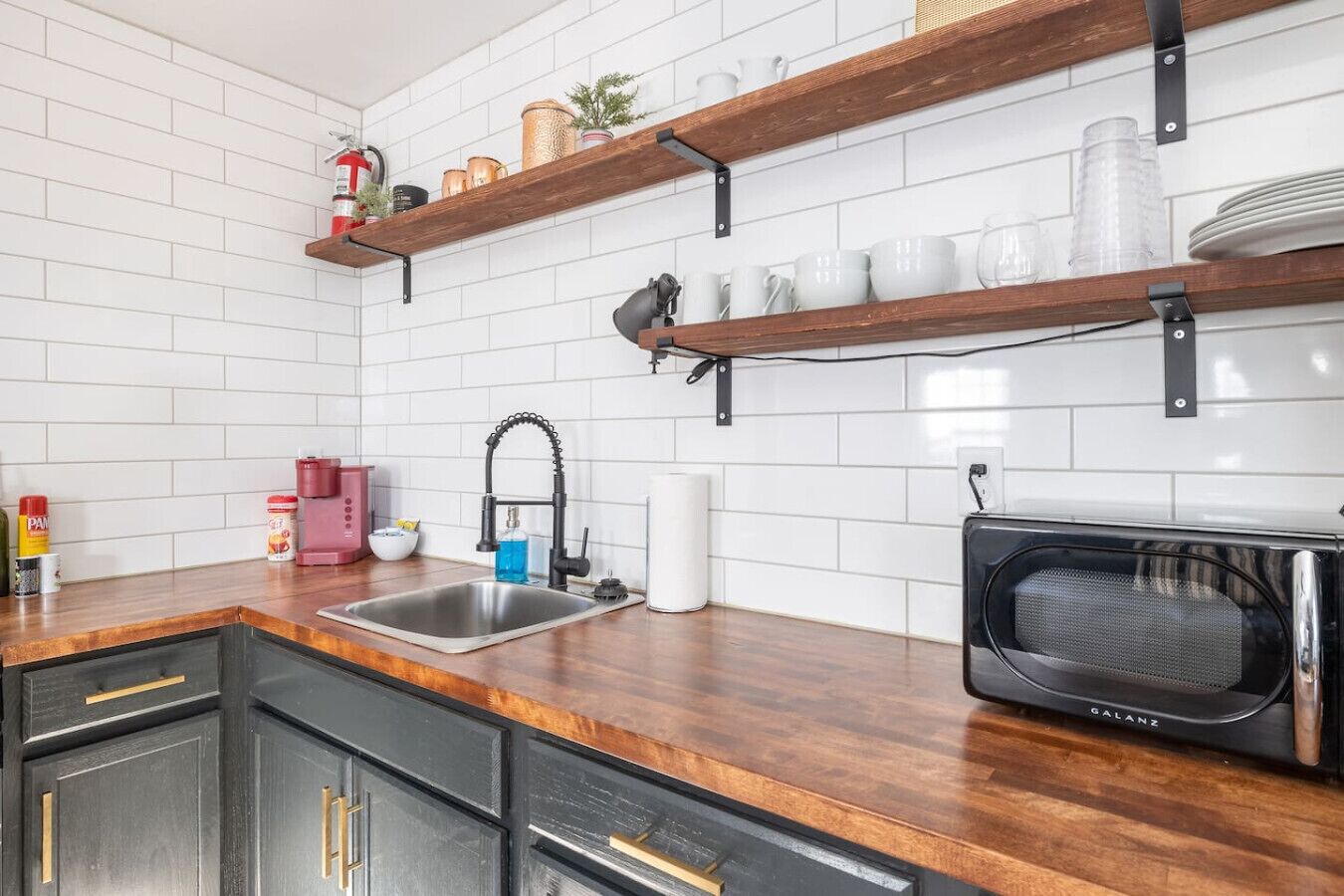 Fridge, coffee/tea maker, toaster, cookware/dishes/utensils