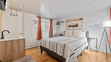 1 bedroom, desk, iron/ironing board, travel crib