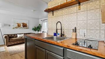 Microwave, coffee/tea maker, toaster, cookware/dishes/utensils