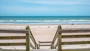 A wooden staircase leading to a beach with a view of the ocean. - Eagles' Landing | Private Pool + Hot Tub, Views! (Surf City)