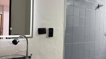Shower, towels, soap, toilet paper