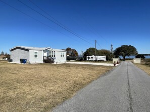 A single-story house with a front porch and a small attached garage.