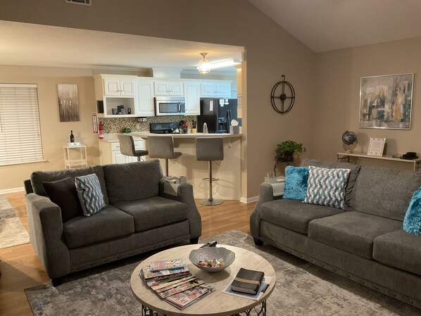 Smart TV, fireplace, books, computer monitors