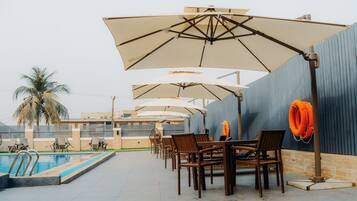 Outdoor pool, pool umbrellas, sun loungers