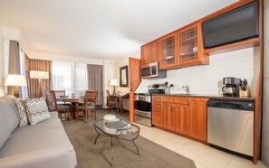 Enjoy a comfortable stay in this well-appointed room featuring a sofa, dining area, and compact kitchenette.