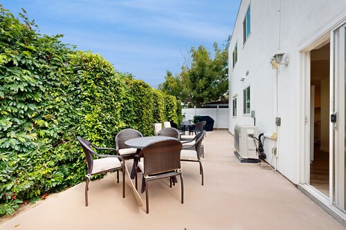 Dog-friendly two-story home with two kitchens, fast WiFi, patio, & gas grill