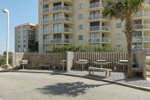 Guests can enjoy balconies and outdoor seating areas with benches and tables.
