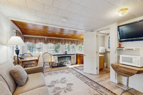 Cute Riverfront Cabin in Great Location w/ Shared Pool, Kitchenette, & Free WiFi