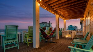 A wooden deck with chairs and a hammock, overlooking the ocean. - New! Beachfront*Spectacular Views*4 bdrm House*Sleeps 14 (Crystal Beach)