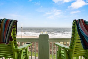 A view from a green chair with a striped towel, overlooking the ocean. - New! Beachfront*Spectacular Views*4 bdrm House*Sleeps 14 (Crystal Beach)