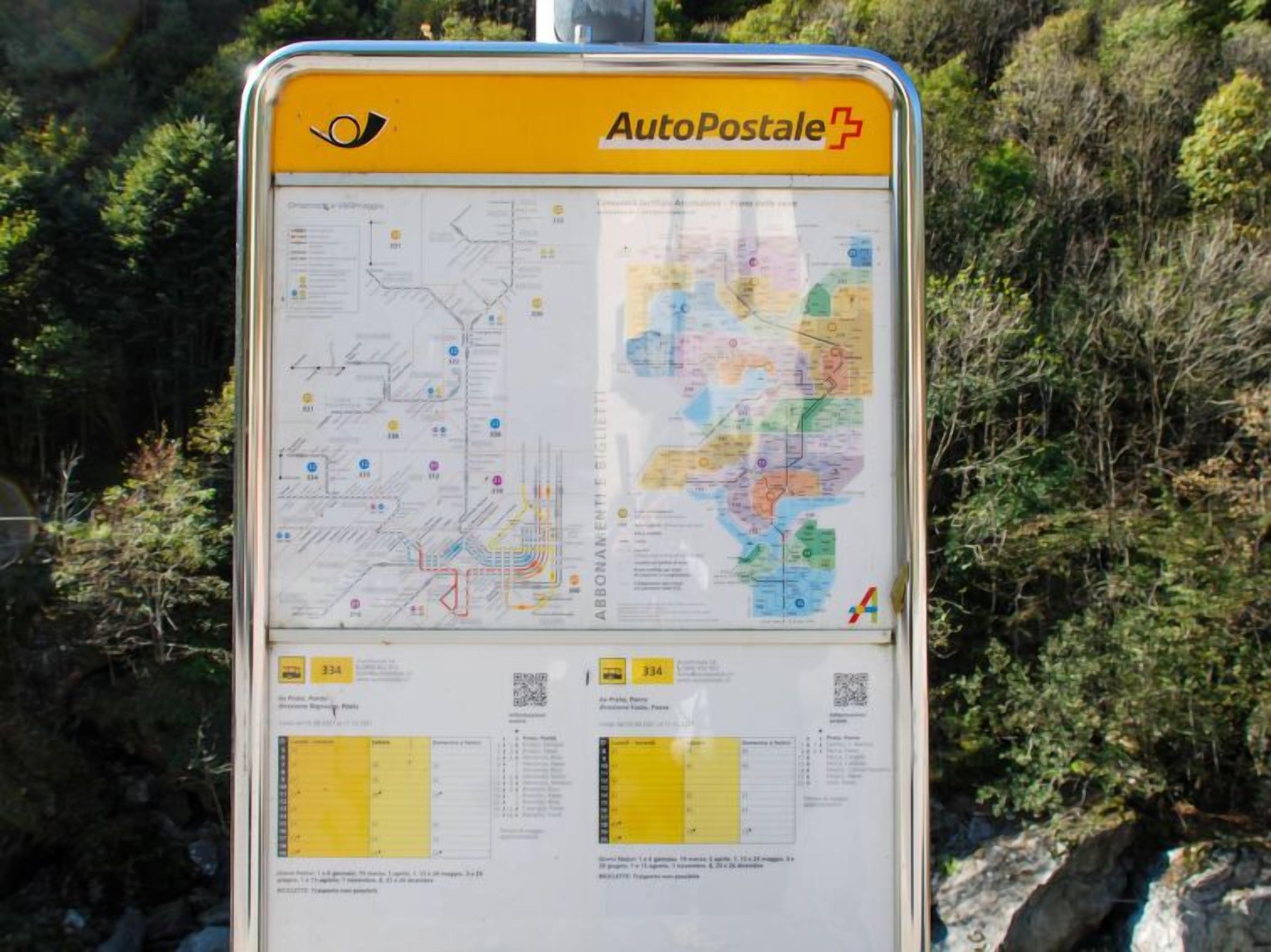 A detailed map and information board for AutoPostale, including route maps and schedules.