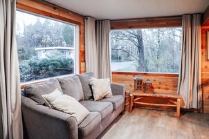Family Cabin, 2 Bedrooms (Pet and Child Friendly) | Living area | Flat-screen TV