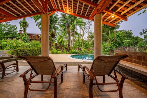 Large Home Set Into Lush Landscape with Private Pool & Gorgeous Deck Area