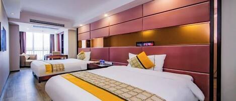 A hotel room with two beds, a large window, and a modern design.