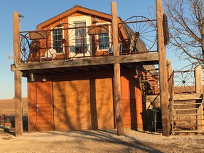 Accessible entrance with a simple, elevated platform and staircase.