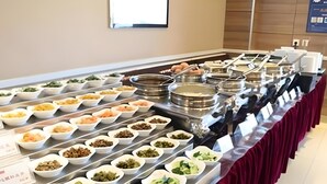 A buffet with various food items arranged in rows. - Home Inn Plus (Changping)