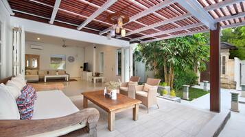 Deluxe Villa, 3 Bedrooms | Living area | 55-inch Smart TV with cable channels, TV, Netflix