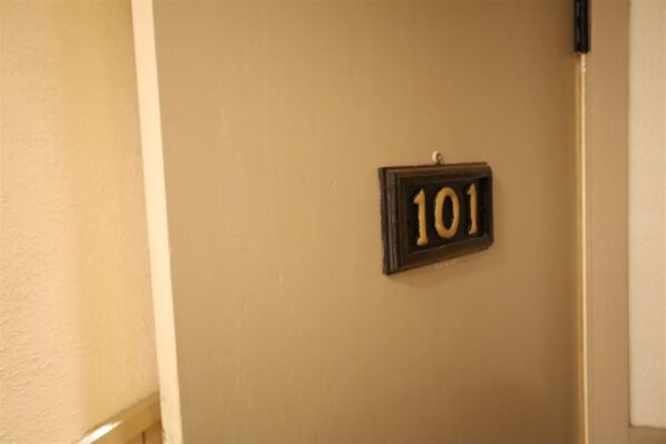 Room 101 features a convenient wall-mounted sign for easy identification.