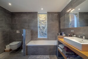 Bathtub, hair dryer, towels
