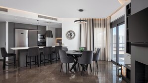 A modern kitchen with a built-in microwave, oven, and a stainless steel refrigerator. - Athenian Riviera Luxurious Villa & Residence (Alimos)
