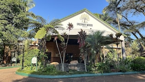 A resort building named Greenway Woods with a sign indicating a reception area and a playground. - Greenway Woods Self Catering Unit no 9, Whiteriver (Mbombela)